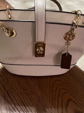 Coach Pebbled Leather Turnlock Tote in ivory and tan accents
